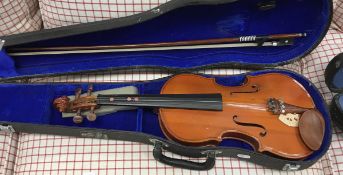 Three various student violins,