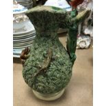 A 19th Century Pailssy style ewer with lizard handle decorated with further amphibians on a