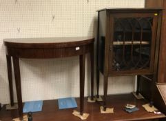 An Edwardian mahogany and inlaid single door display cabinet,