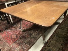 A 19th Century rounded rectangular snap top tea table on pedestal tripod base