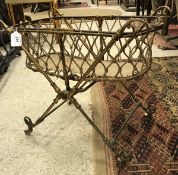 A Victorian laquered brass dolls folding crib on an X-framed base CONDITION REPORTS