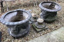 A pair of 18th Century (possibly earlier) lead garden urns with satyric mask and floral drape