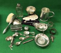 A collection of various small silver wares to include desk oil lamp, sauce boat, sugar bowl,