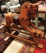 A modern wooden rocking horse by G.N.
