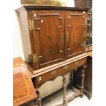 A 18th Century walnut two door cabinet with fitted interior of various drawers (centre section