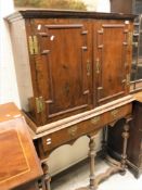 A 18th Century walnut two door cabinet with fitted interior of various drawers (centre section