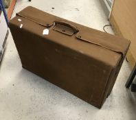 A leather vanity case bearing initials "ACT" with fitted interior of ivory monogrammed bottles etc