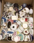 A box of various china, soapstone and other trinket boxes,