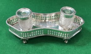 A Victorian silver desk stand of double lozenge form with gadrooned rim and pierced gallery sides,