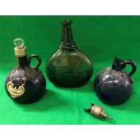 An early 19th Century glass bottle of moon flask form, with trail decoration to the neck,