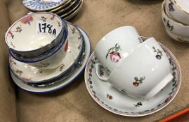 A pair of Newhall polychrome decorated pottery tea bowls and saucers with writhen decoration