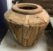 A modern teak urn