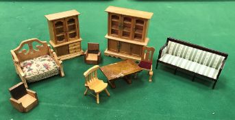 A crate containing various wooden and other dolls house furniture