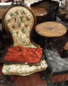 A Victorian carved walnut framed button back salon chair on cabriole front legs to castors,