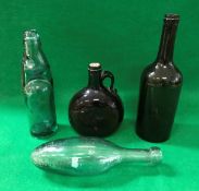 A 19th Century green glass bottle, toget