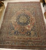 A Persian rug, the centre flower head me