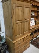 A modern pine wardrobe with two cupboard