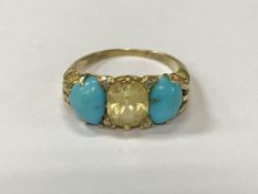 A gold mounted turquoise and diamond set