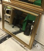 A modern gilt framed wall mirror