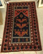 A Caucasian rug, the central panel with