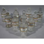 Ten late 19th/early 20th century glass pharmacy bottles, cylindrical,