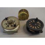 An Intrepid FR35 Graphite composite reel, cased; two vintage reels, one by Strike Rich Tide Flo,