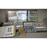 Four albums with a collection of EIIR 'Presentation Packs' (approximately 180+) mint unused,