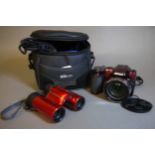 Nikon Coolpix L120 red digital bridge camera, cased; together with Nikon Aculon T01 binoculars,