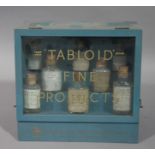 A 'Tabloid' Fine products counter display box, with glazed hinged front and tiered interior,