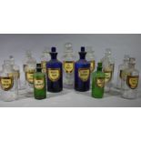 Fifteen late 19th century glass pharmacy bottles, cylindrical,