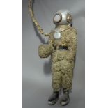 A vintage advertising figure of a bell diver made from natural sponges and papier mâché,