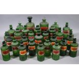 A set of twenty-nine late 19th/early 20th century green ribbed glass pharmacy bottles, cylindrical,