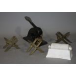 Three brass 'X' framed adjustable stands 9cm high,