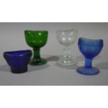 Three pedestal eye baths in blue,