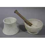 A small pestle and mortar of conventional form together with a tapered cylindrical mortar 13.