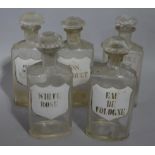 A set of five late 19th/early 20th century clear glass flask pharmacy bottles for toilet water each