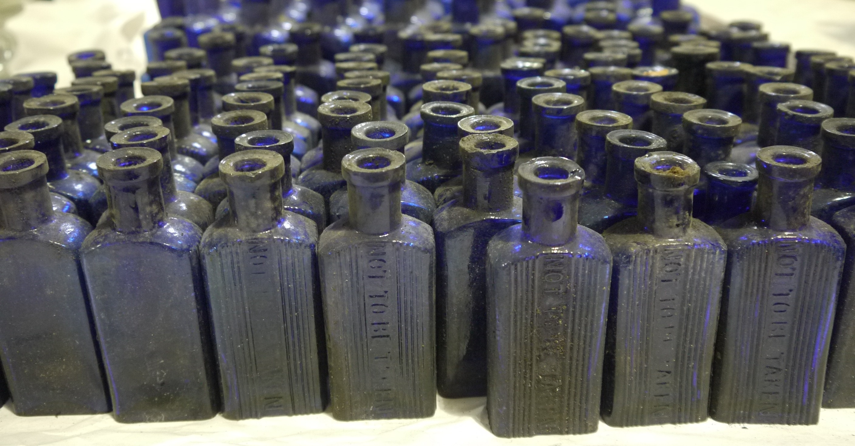 A quantity of blue glass pharmacy flask-shaped bottles, ribbed and moulded 'Not To Be Taken', - Image 2 of 2