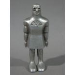 A continental cast aluminium robot, the upper body with sunken circular eyes and smiling mouth,