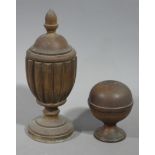 A Victorian treen cup and cover with finial, reeded body on a circular foot,