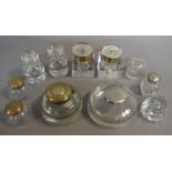 A pair of late Victorian glass inkwells of chamfered square form, brass collars with hinged lids,