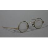 A pair of late 19th century gilt metal framed child-size spectacles