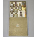 Twelve small perfume bottles and phials,