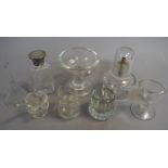 Two late 19th/early 20th century eye baths, a small moulded glass funnel,