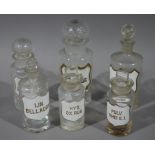 Six 19th century clear glass pharmacy bottles, cylindrical,