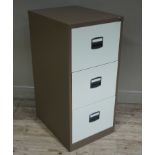 A three drawer brown and cream filing cabinet,