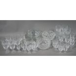 A large quantity of cut and later glass ware including bowls wine glasses, tumblers etc.