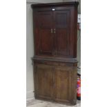 A 19th century mahogany and oak corner standing cupboard,