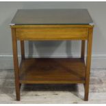 A reproduction mahogany two tier occasional table with glass top, 56cm wide,