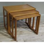 A set of reproduction teak tables, rectangular outline on flattened legs,