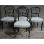 A set of four walnut salon chairs,